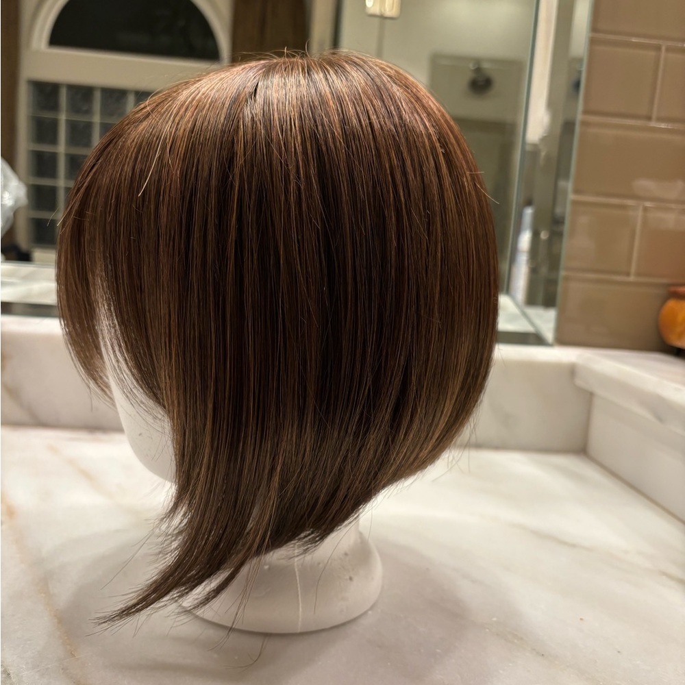 Wig. Medium auburn brown, stylish graduated bob hairstyle.